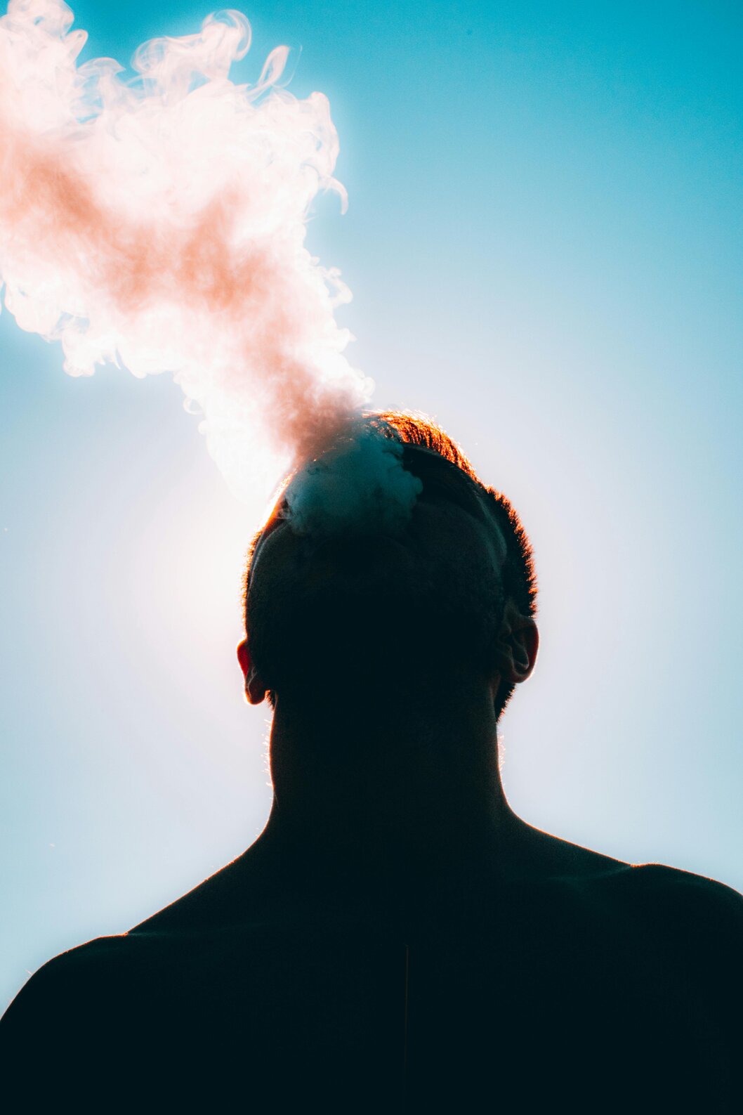 Person breaking a cigarette to symbolize quitting smoking