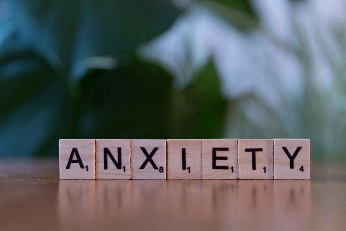 Person practicing calming breathing to manage anxiety